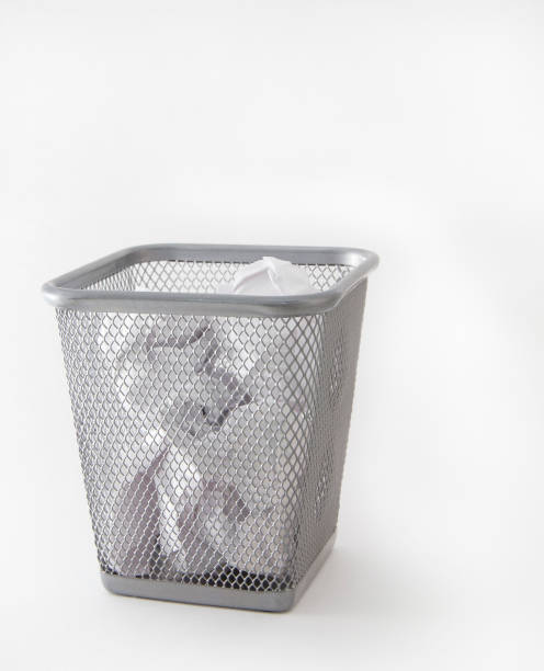 istock Crumpled paper in the metal trash bin 873532110