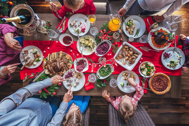 istock Family Having Traditional Christmas Dinner with Roasted Veal Rack 873535566