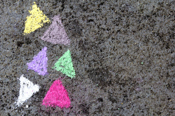 istock chalk drawing on asphalt: colorful triangles 873536506