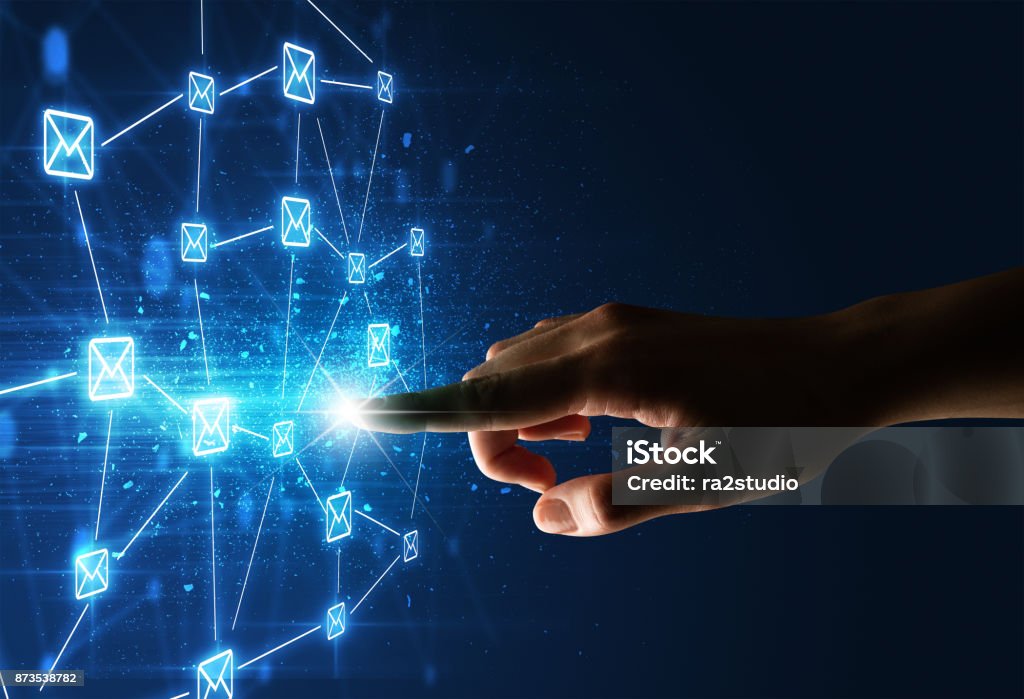 Finger touching interface Female finger touching a beam of light surrounded by a blue graphic with envelopes Device Screen Stock Photo