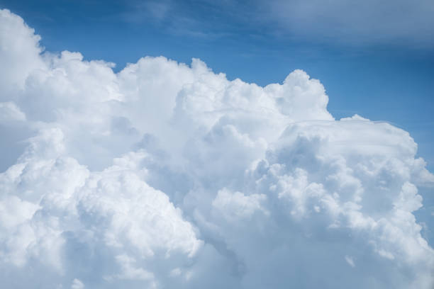 istock Big bulk of fluffy clouds on the blue sky. 873539668