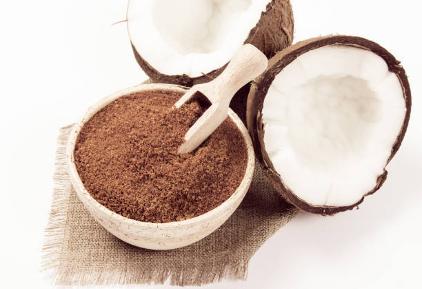 istock Coconut with coconut sugar isolated on white background. 873544166