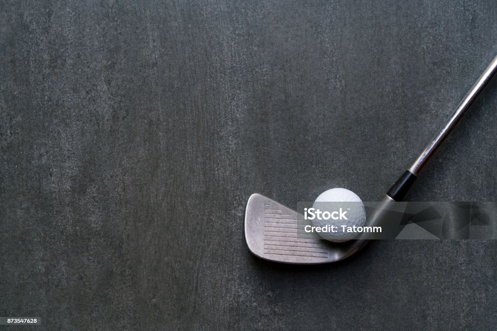 golf ball and golf club on black background Golf Stock Photo