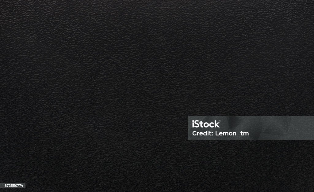 Black plastic texture background. Dark rough material in pvc object. Black Color Stock Photo
