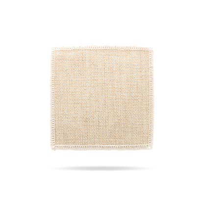 Square coaster on isolated background with clipping path. Fabric pad for put your mug or cup.