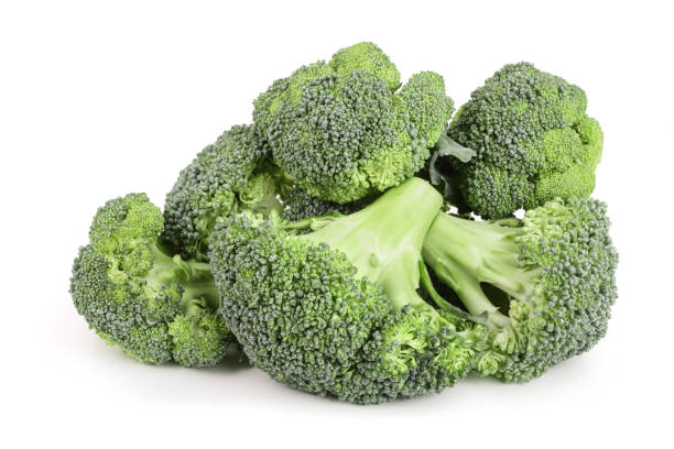 istock fresh broccoli isolated on white background close-up. Top view 873550952