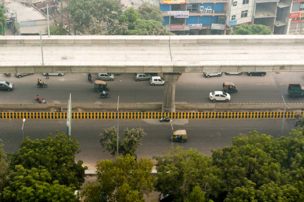 istock Metro bridge over busy street in Delhi 873551476