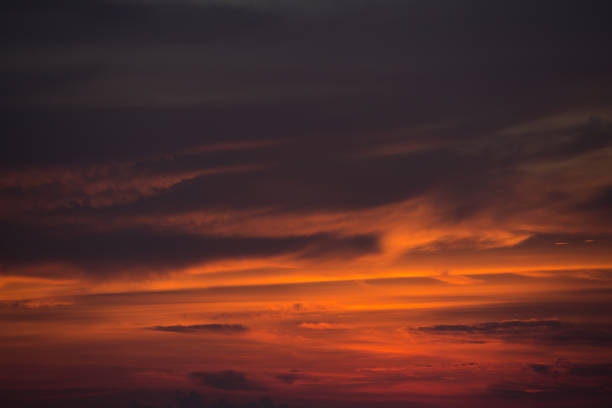 istock beautiful magical orange coulds, sky over ocean 873554798