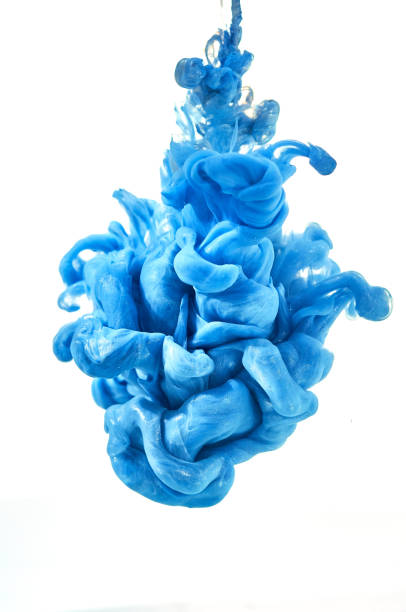 istock ink in the water. A splash of blue paint. Abstract background 873557604