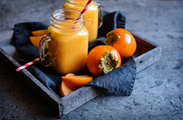 kuvapankkikuvat ja rojaltivapaat kuvat aiheesta persimmon smoothie lasipurkeissa - khaki