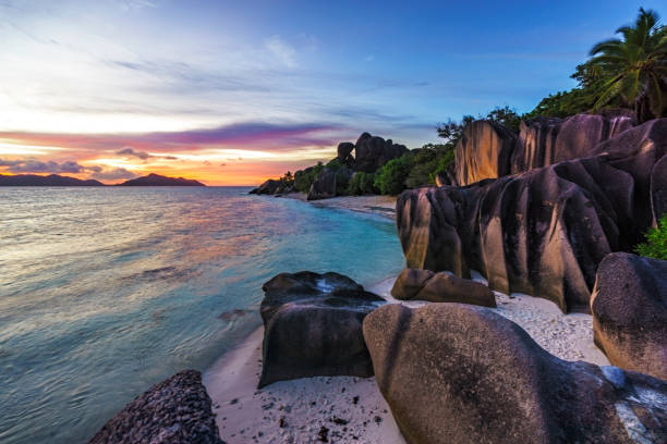 istock romantic sunset in paradise, silver spring cove, the dike, seychelles 15 873570020