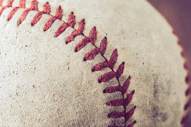 istock old Baseball on wood background with filter effect retro vintage style 873572514