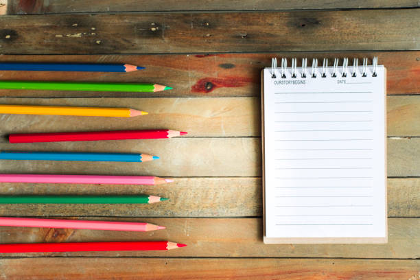 istock Notepad with pencil on wood board background.using wallpaper for education, business photo.Take note of the product for book with paper and concept, object or copy space. 873581218