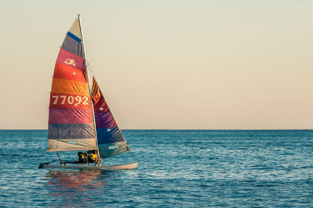 Hyères, France - July 22, 2003 : Windsurfers on a windy day at a Mediterranean beach.