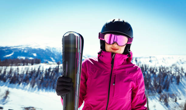 istock Woman with ski in the mountains 873594306