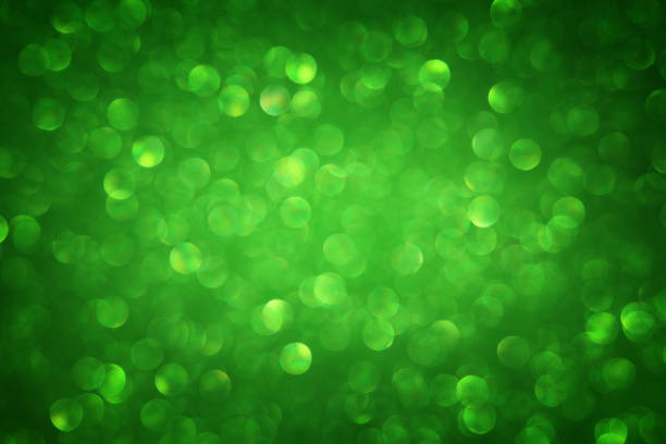 istock Green glitter vintage lights background. de-focused. 873594426