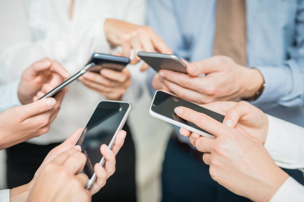 istock Friends having fun together with smartphones. 873594952