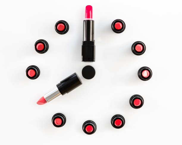 istock clock face and arrows on white background made from lipsticks 873597760