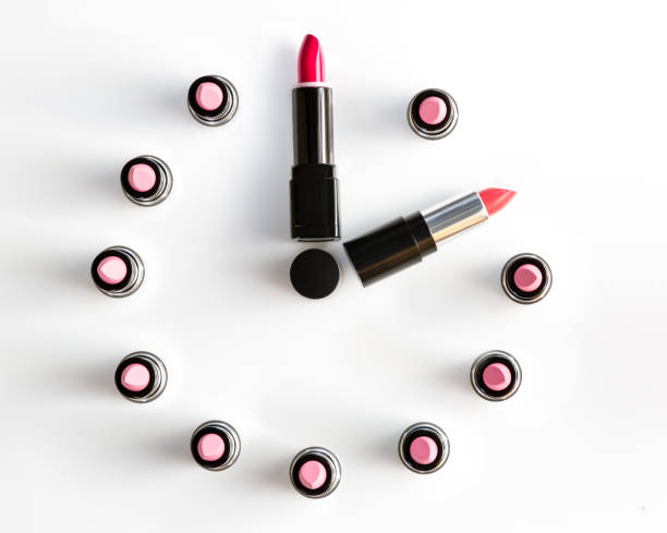 istock clock face and arrows on white background made from lipsticks 873597816