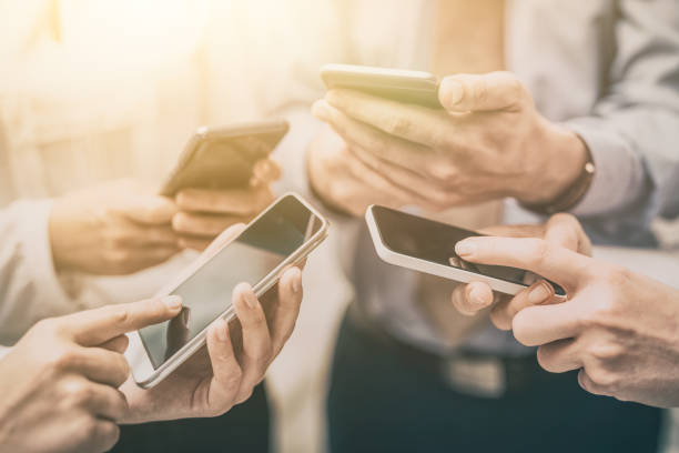 istock Friends having fun together with smartphones. 873598152