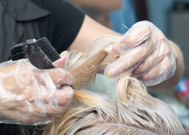 istock hair coloring in the salon 873598154