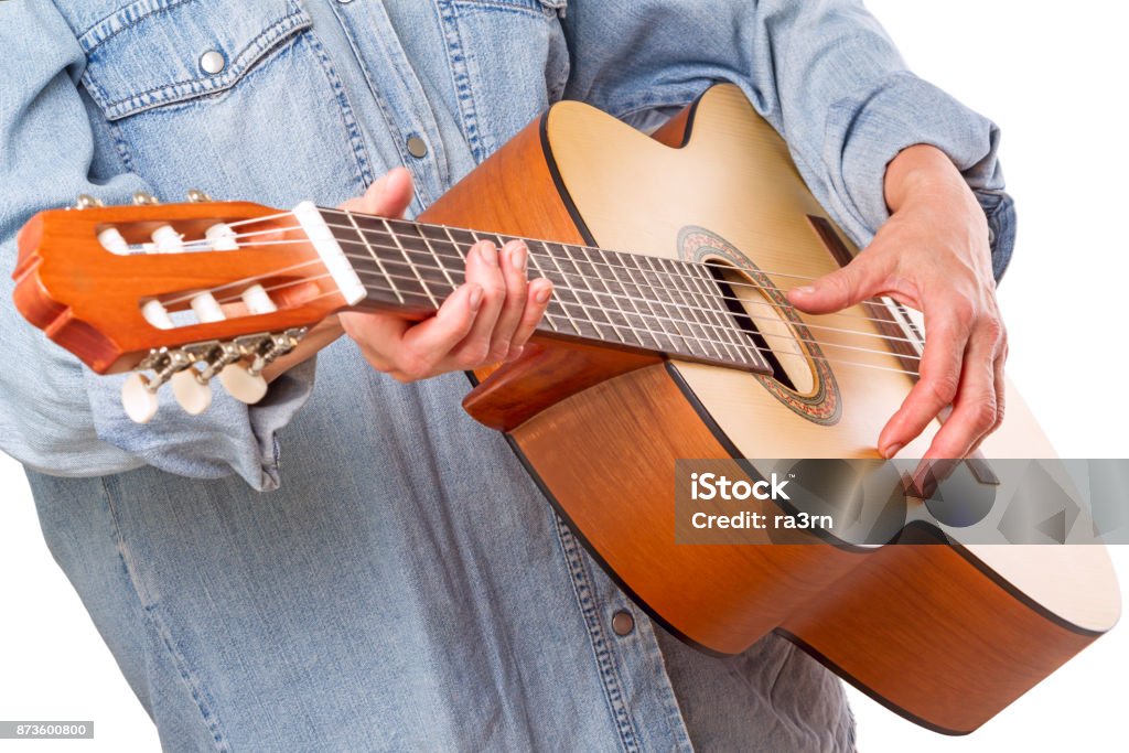 Woman and six-stringed guitar Hand woman and simple six-stringed guitar Adult Stock Photo