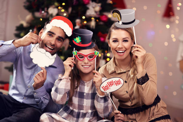 istock Happy family having fun during Christmas time 873605550