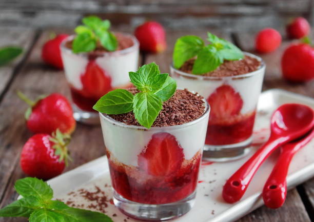 istock Tiramisu with fresh strawberries in a glass 873608980