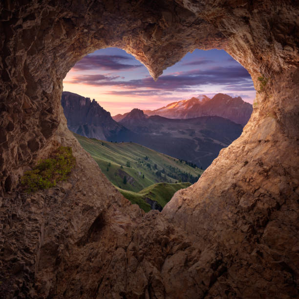 istock View from heart shape cave to the idyllic mountain scenery 873617062