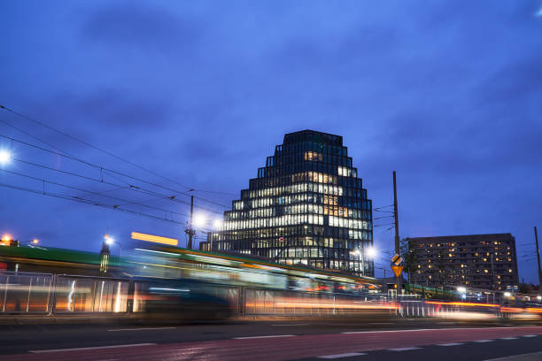 istock Cars, trams and a modern office building 873623282