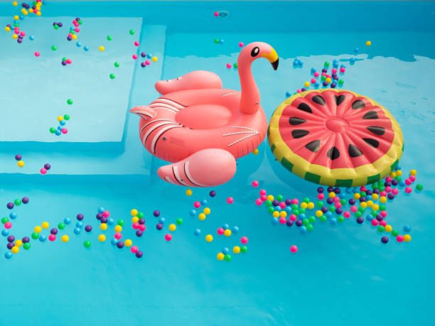 カラフルなプール floaties - swimming pool party summer beach ball ストックフォトと画像