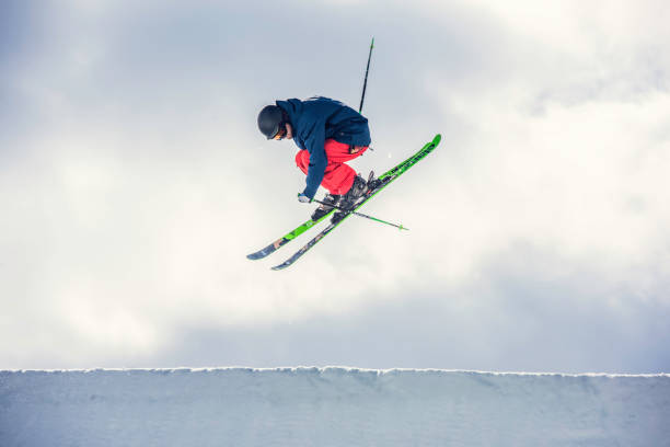 istock Freestyle skier in mid-air during a half pipe jump 873627486