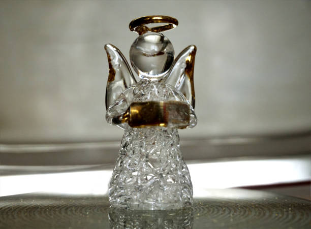 Glass angel reading book