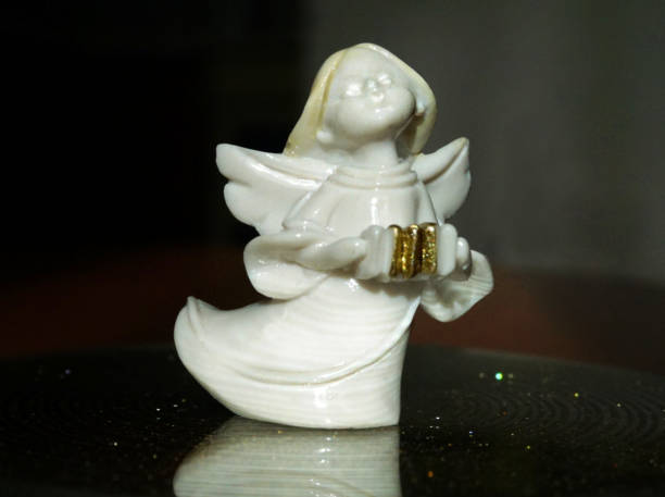 istock Vintage ceramic angel in contrasting background 873627852