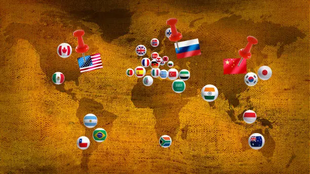 Photo of various flags on a stylized map of the world