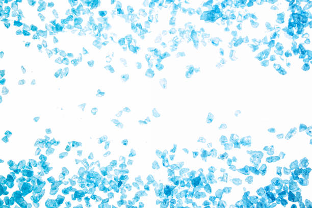istock Blue sea salt crystals on white background 873632886