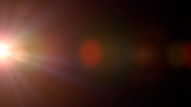 istock bright sunny lens flare effect with bokeh, overlay texture in front of a black background 873632938