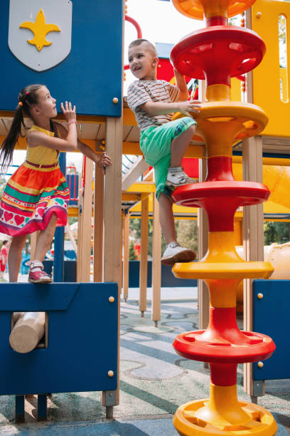 istock Little fidget children get fun in the park 873635152