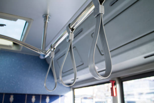 バスのハンドル - bus inside of people train ストックフォトと画像