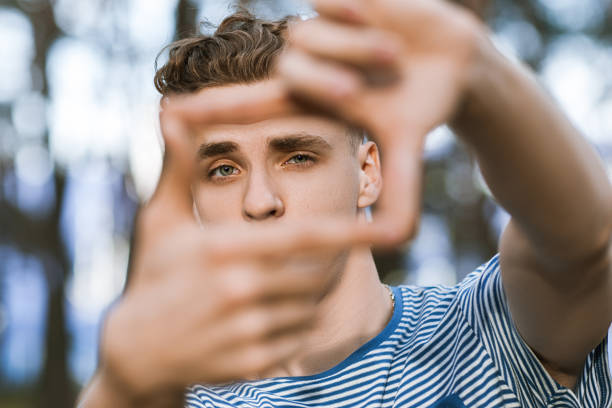 istock Imaginary camera man nature photographer concept. 873636040