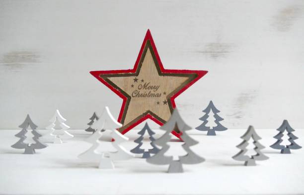 istock Gray white wooden trees on white shabby chic wall 873636528
