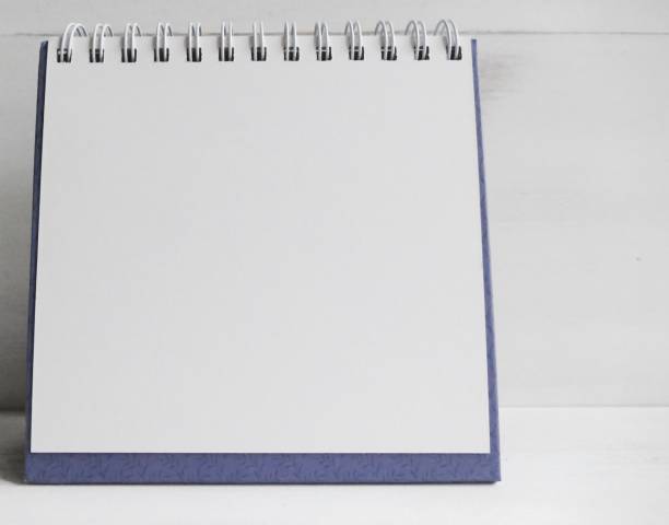 istock Clipboard with white paper on white wooden wall 873639270