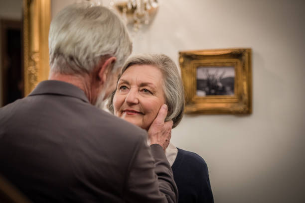 istock Senior man saying goodbye to his wife 873639544