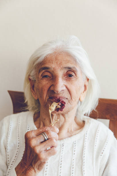 istock Senior Women With Flower 873643752