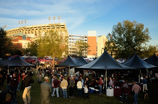 Mississippi State, Mississippi, USA - November 11, 2017: Fans tailgating near Davis Wade Stadium at Scott field just prior to the Mississippi State University versus The University of Alabama football game on the campus of Mississippi State University.