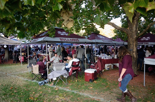 Mississippi State, Mississippi, USA - November 11, 2017: Fans tailgating just prior to the Mississippi State University versus The University of Alabama football game on the campus of Mississippi State.