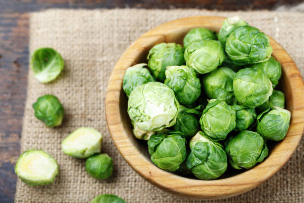 istock raw brussels sprouts in a plate on a wooden background 873649906