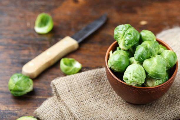 istock raw brussels sprouts in a plate on a wooden background 873649910