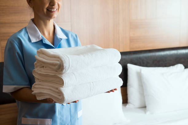 istock Maid with Clean Towels 873650760