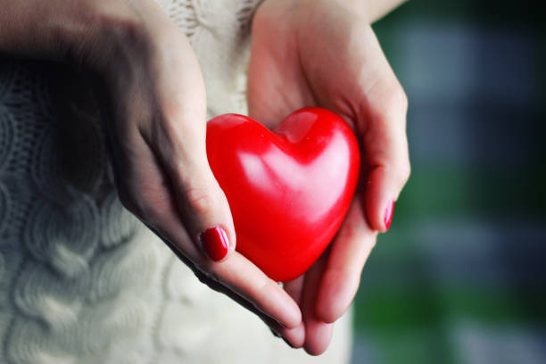 istock female hand valentine heart 873657604